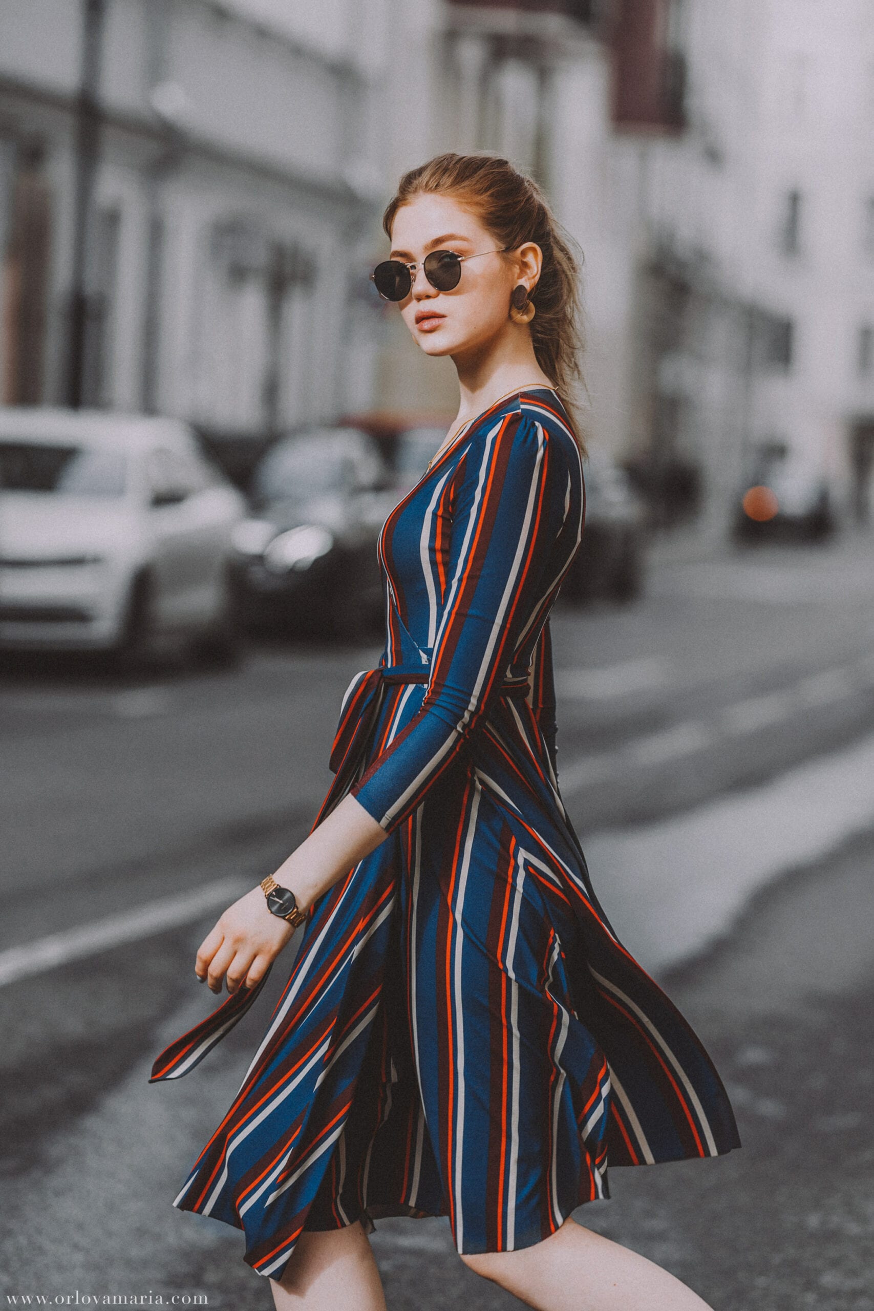 Woman downtown in a dress.